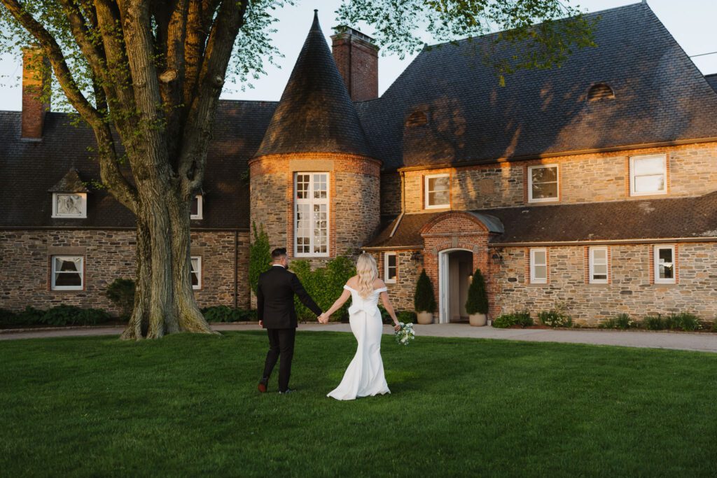 Bride and groom taking sunset portraits at Shepherd’s Run in South Kingstown by wedding photographer Madison Van Wylen