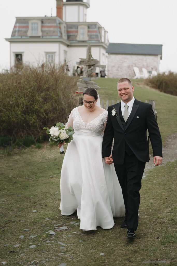 Bride and groom walking a path at Rose Island Newport RI